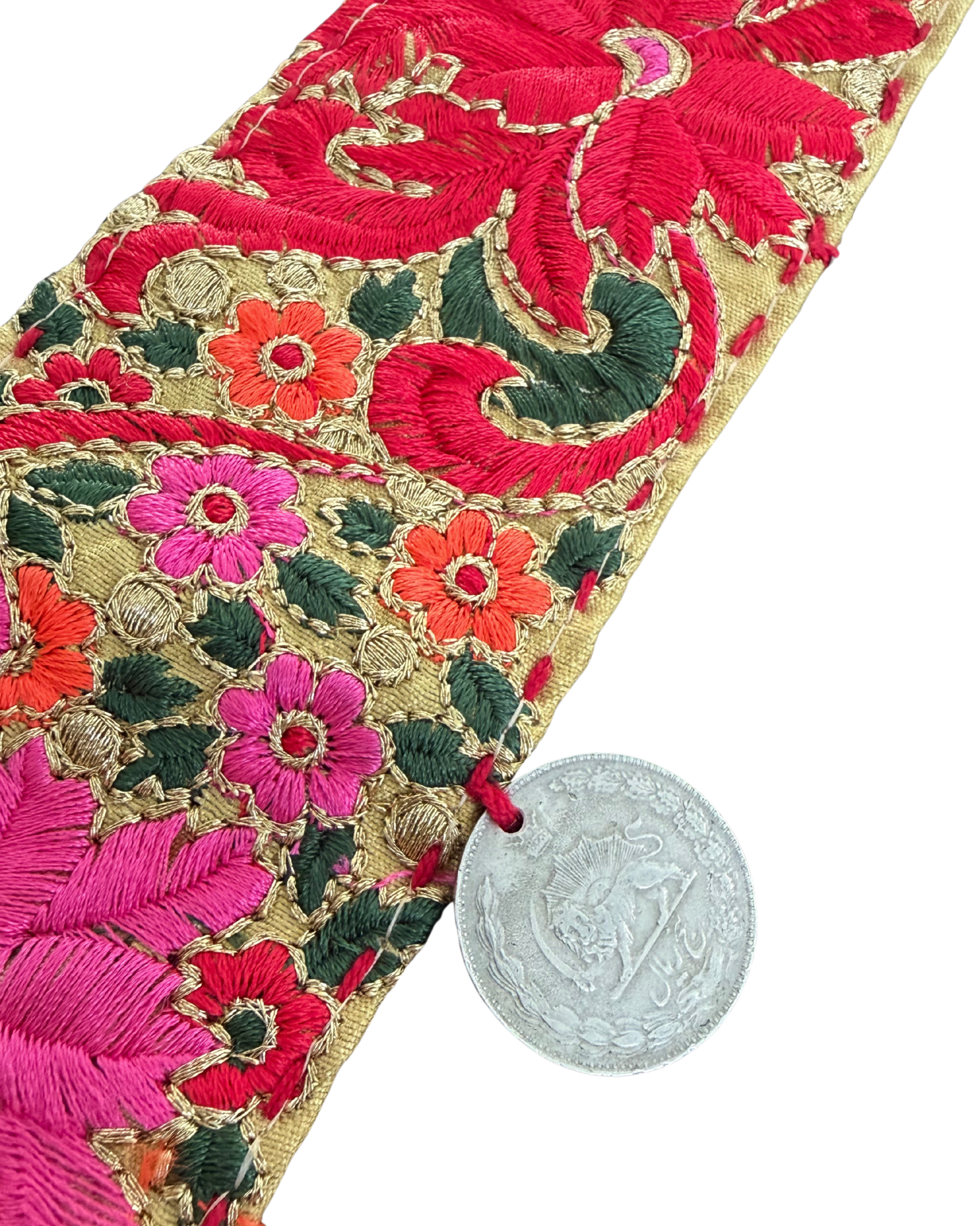 Decorative embroidered waist belt on neutral background