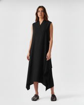 Sleeveless black linen asymmetric dress on model