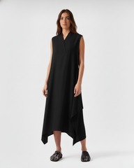 Sleeveless black linen asymmetric dress on model