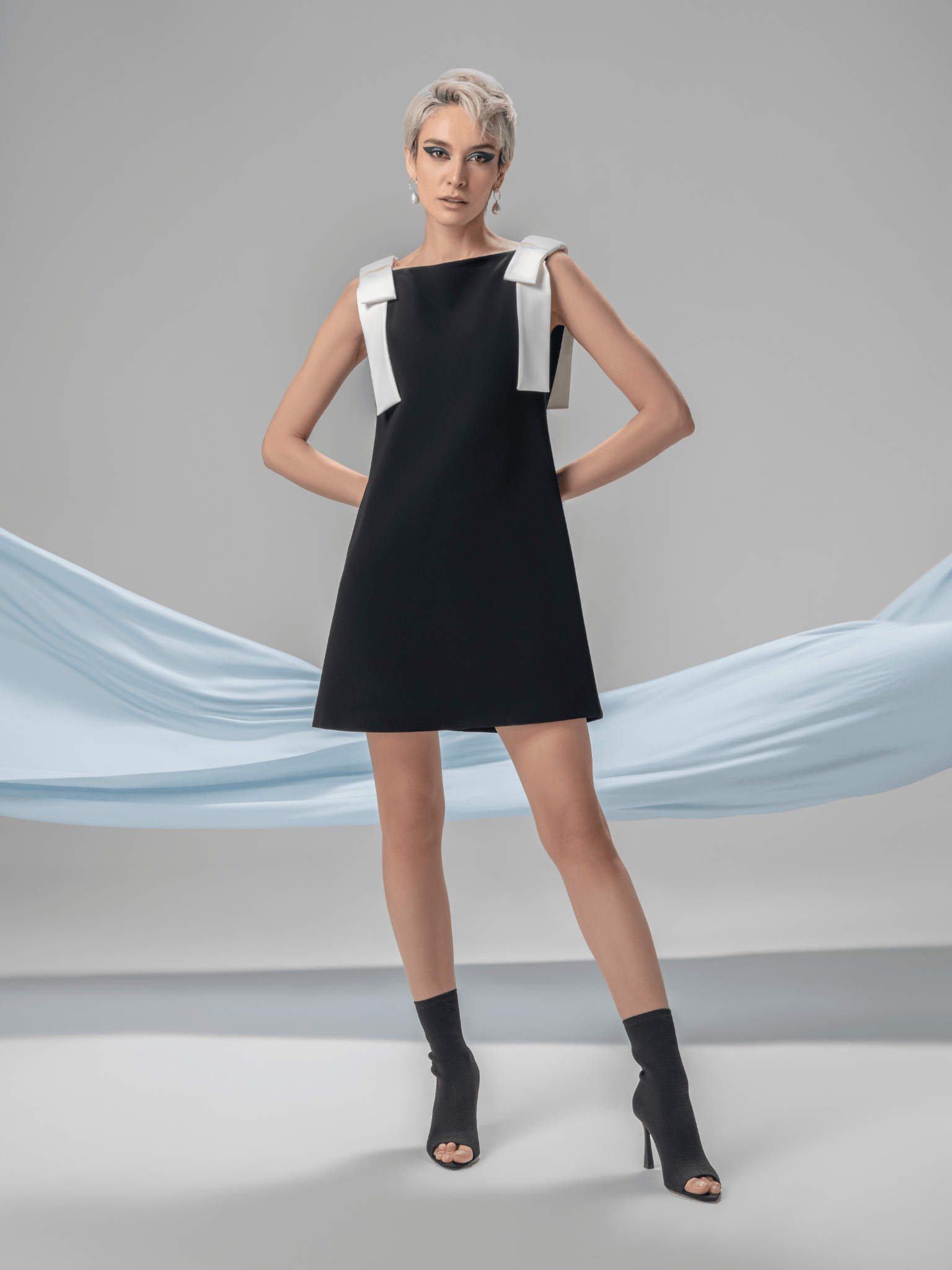 Black and white Fara cocktail dress with sculptural bow details