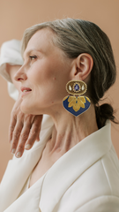 Model wearing handmade statement earrings