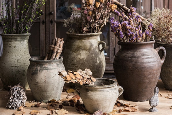 Handcrafted porcelain vases in nostalgic rustic setting