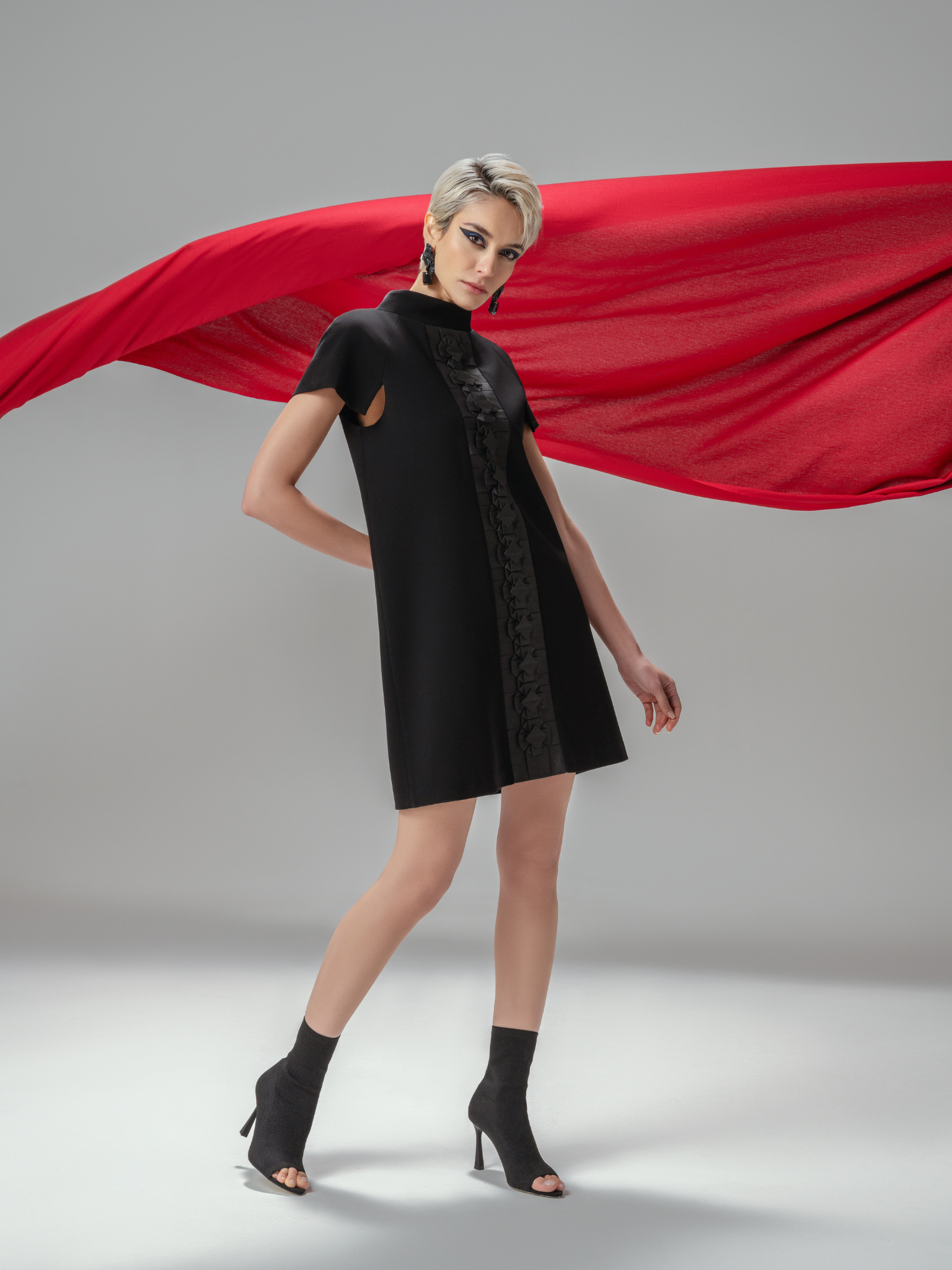 Handmade black crepe dress with sculptural origami embellishment
