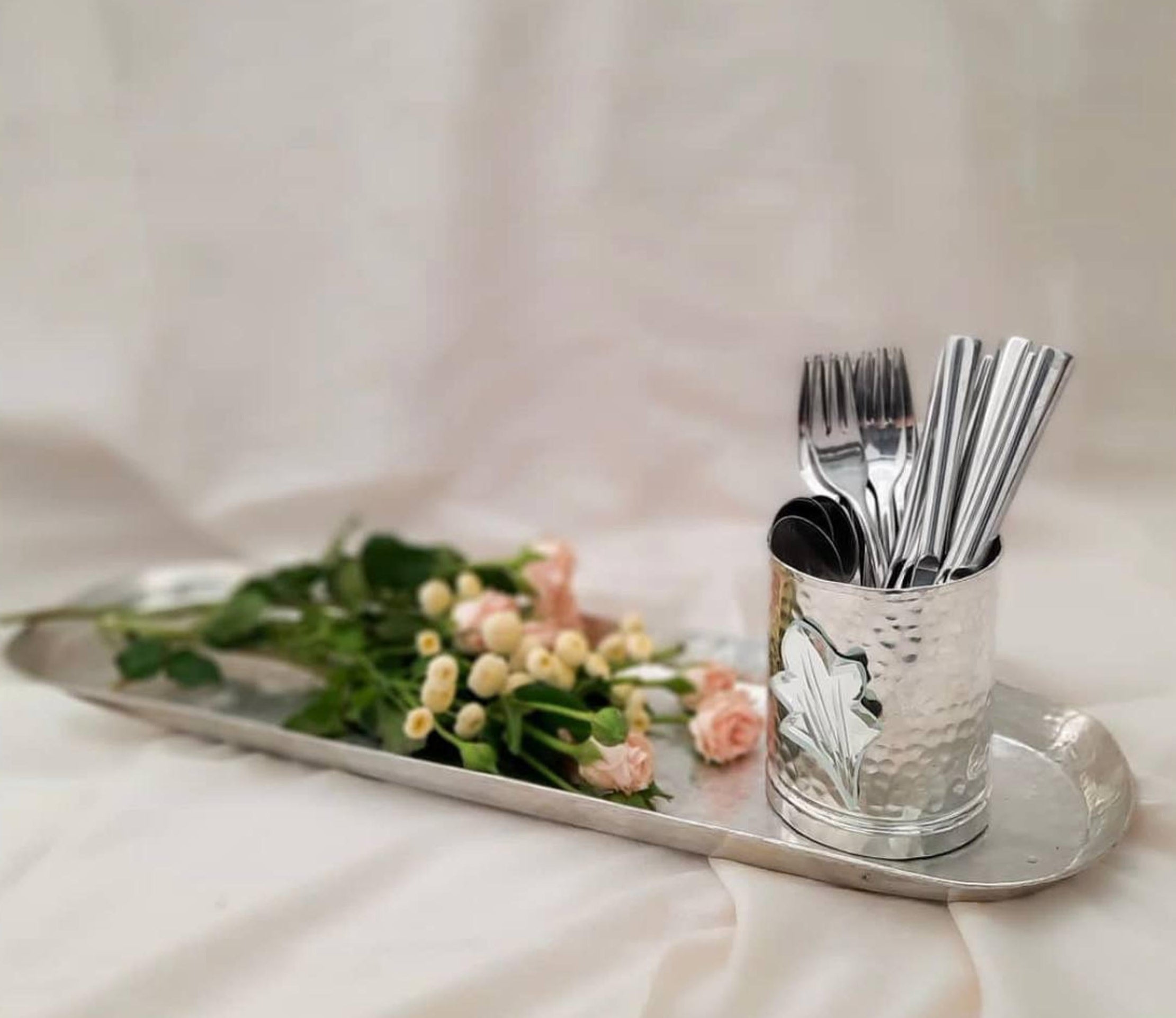 Handmade hammered utensil cup on tray