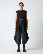 Modern architectural linen top styled with wide leg pants