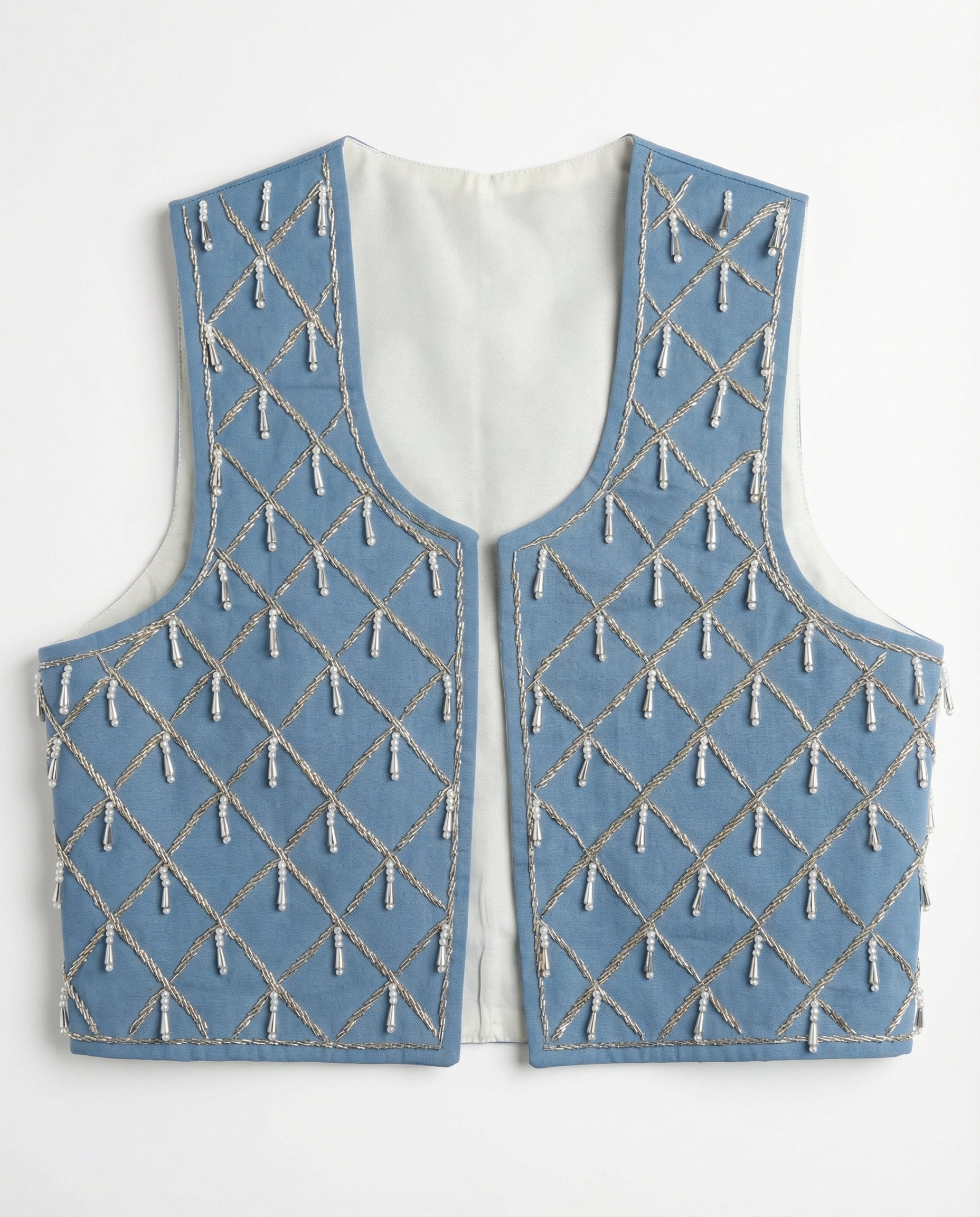 Blue embroidered vest on a white background