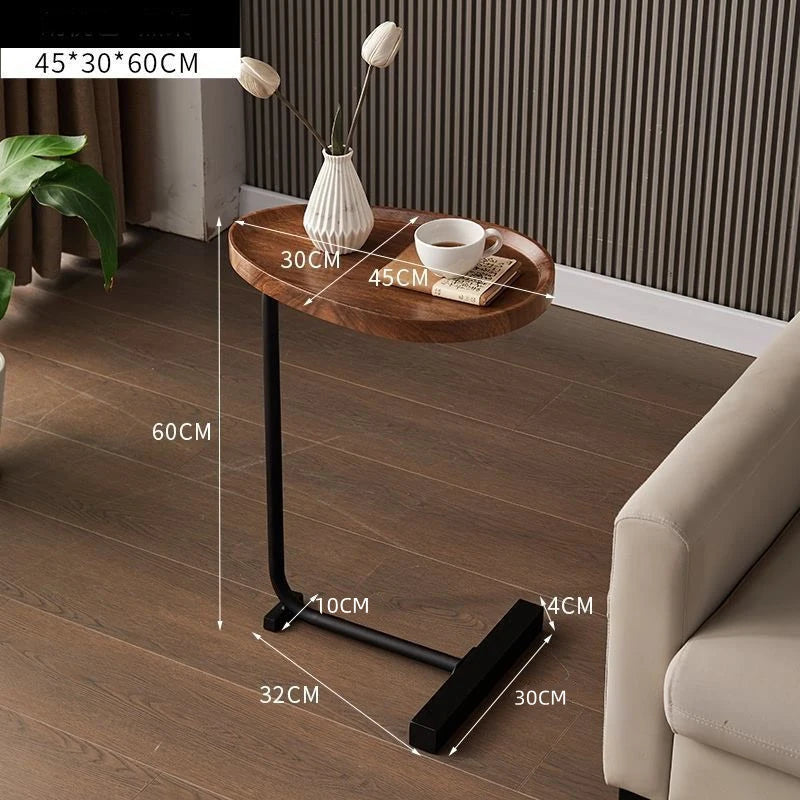 Small wooden side table with dimensions labeled in a living room setting.