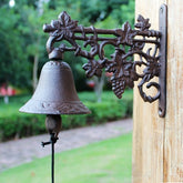Rustic metal bell mounted on a wall