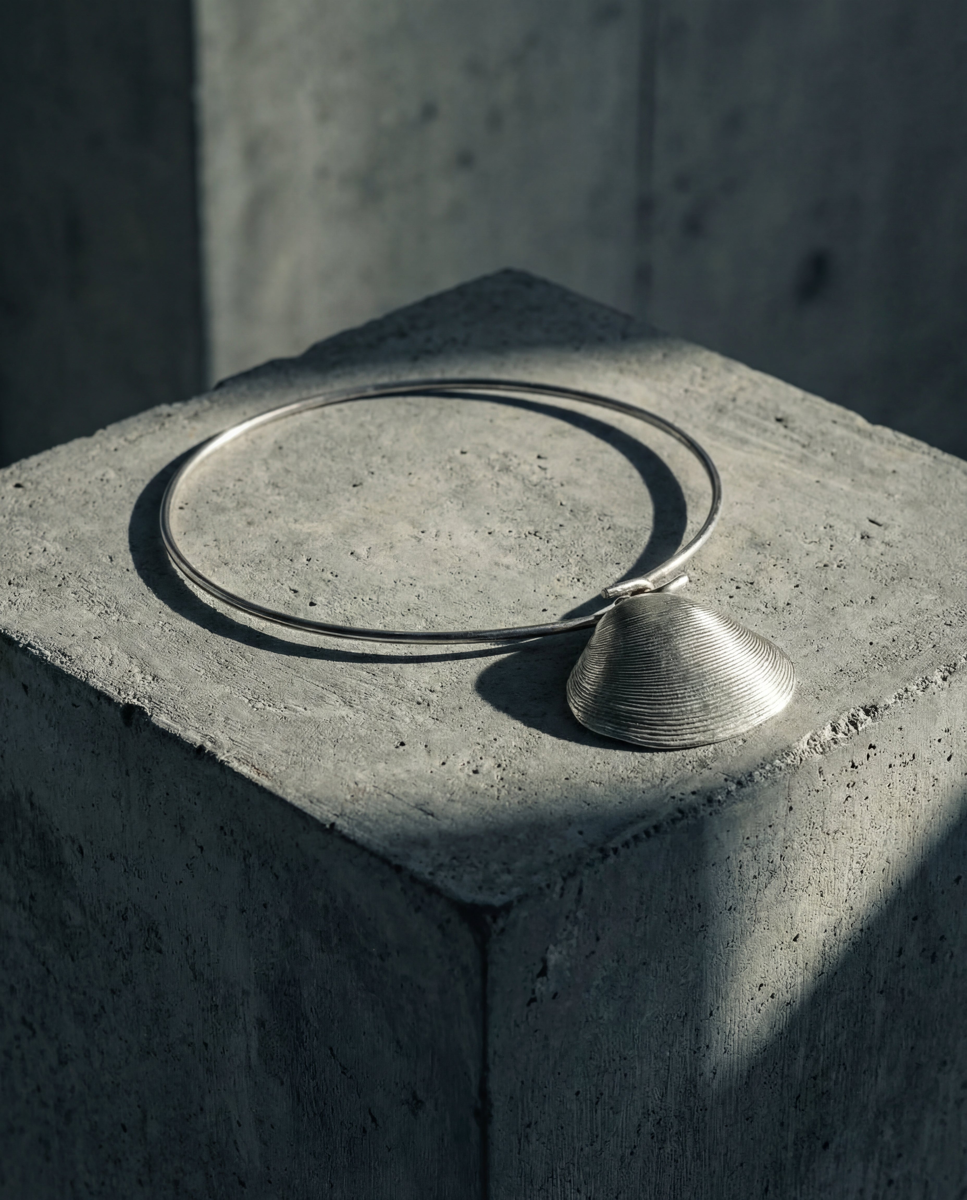 Contemporary sculptural silver pendant close up