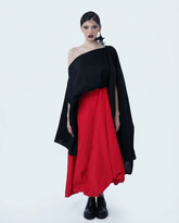 Statement red midi skirt with architectural silhouette