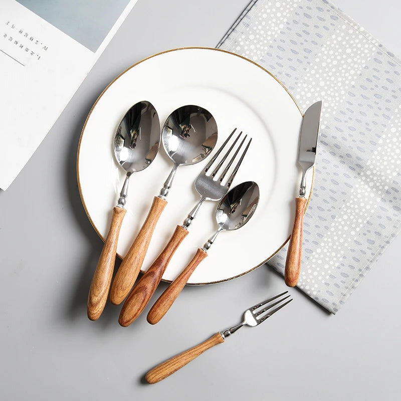 Stainless steel cutlery set with polished wooden handles
