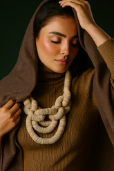 Eco-friendly statement jewelry worn by model