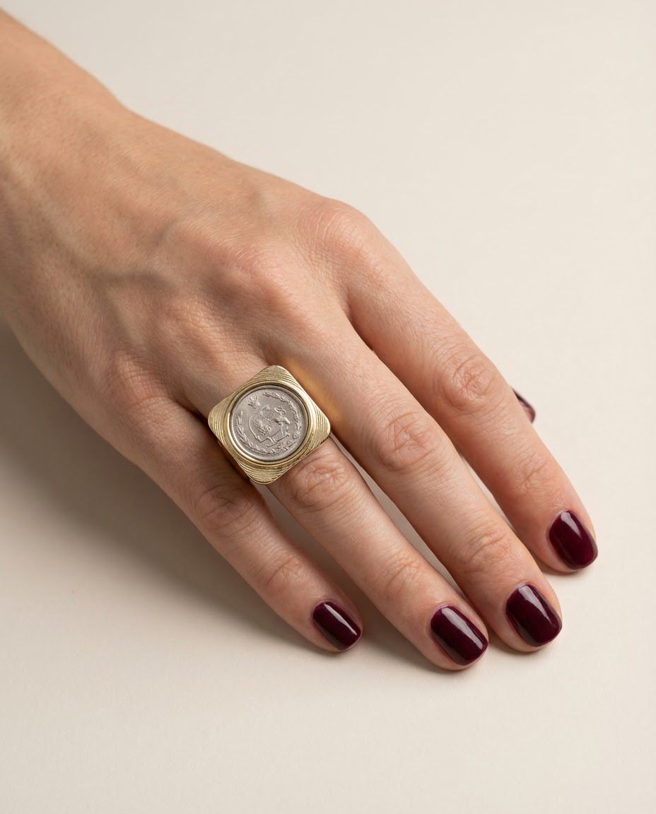 Persian coin statement ring on hand