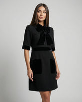 Elegant black velvet dress with tailored silhouette