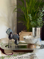 Single handcrafted metal bird sculpture with cut-out feather tail