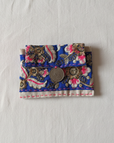 blue floral embroidered card holder with coin charm