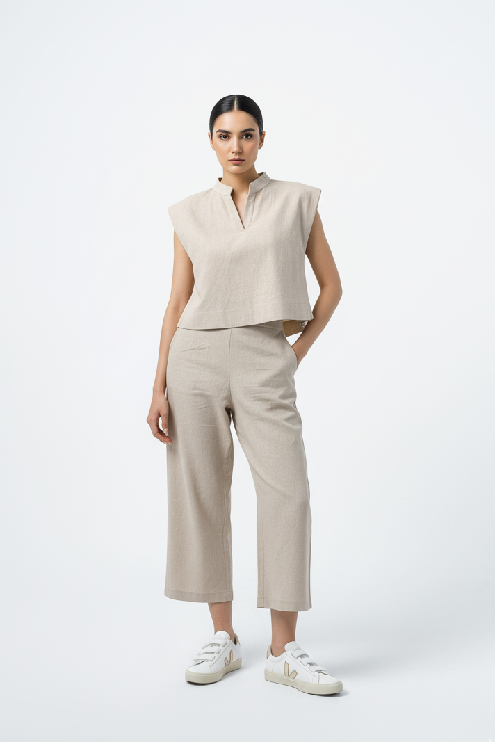 Neutral-toned linen outfit consisting of a sleeveless boxy top and matching cropped pants, perfect for minimalist looks