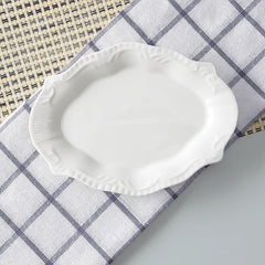 White ceramic dish on a checkered cloth