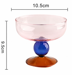 Colorful glass bowl with measurements on a white background