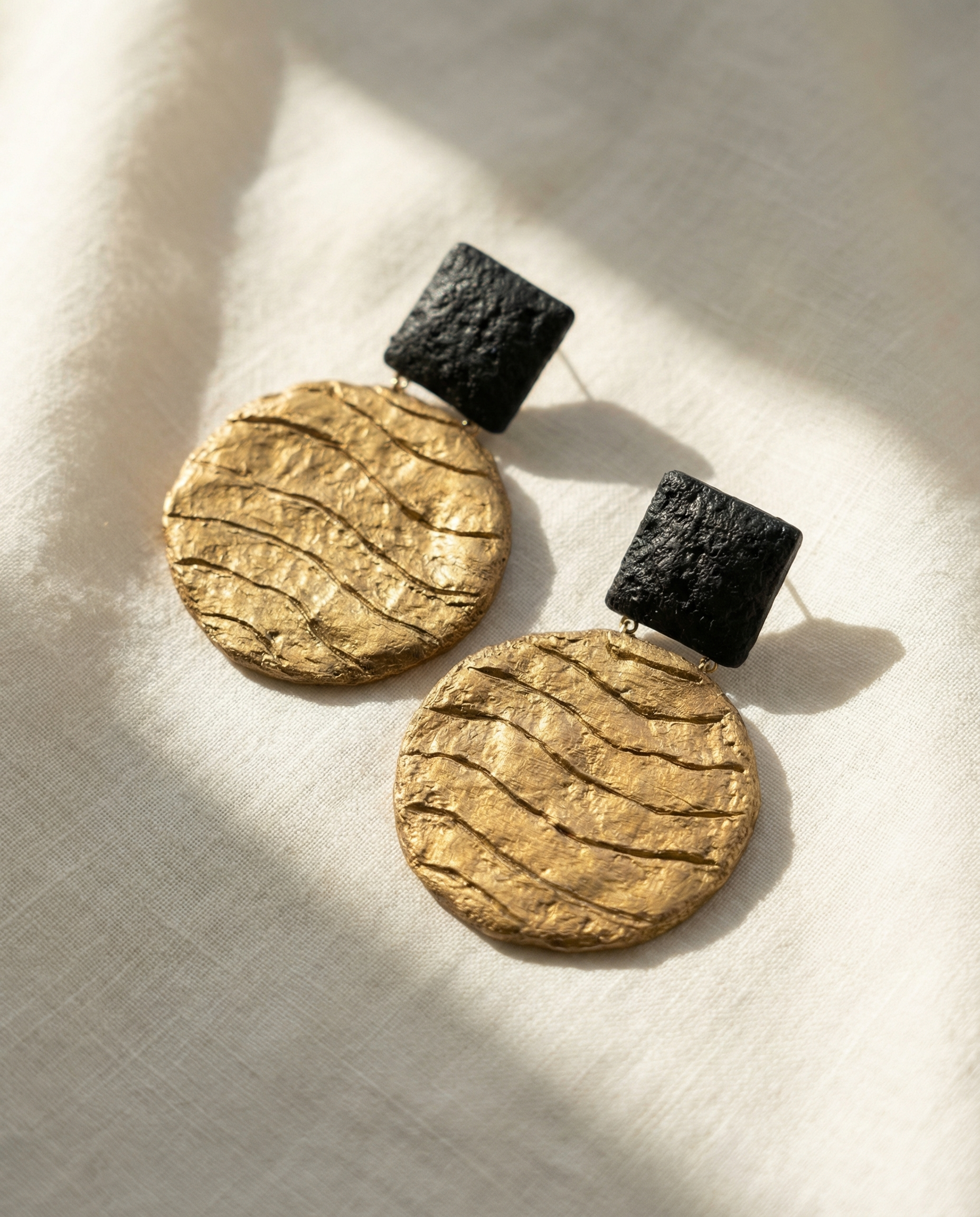 gold artistic earrings
