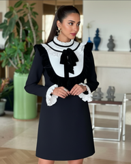 Elegant cocktail dress with ruffled collar and velvet trim