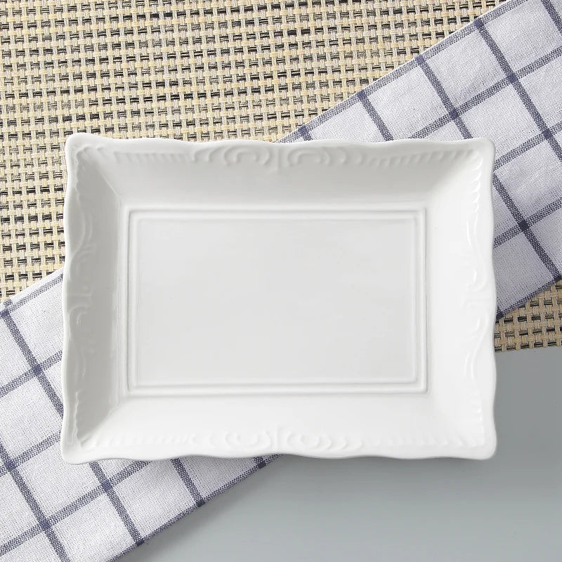 White ceramic rectangular dish on a checkered cloth