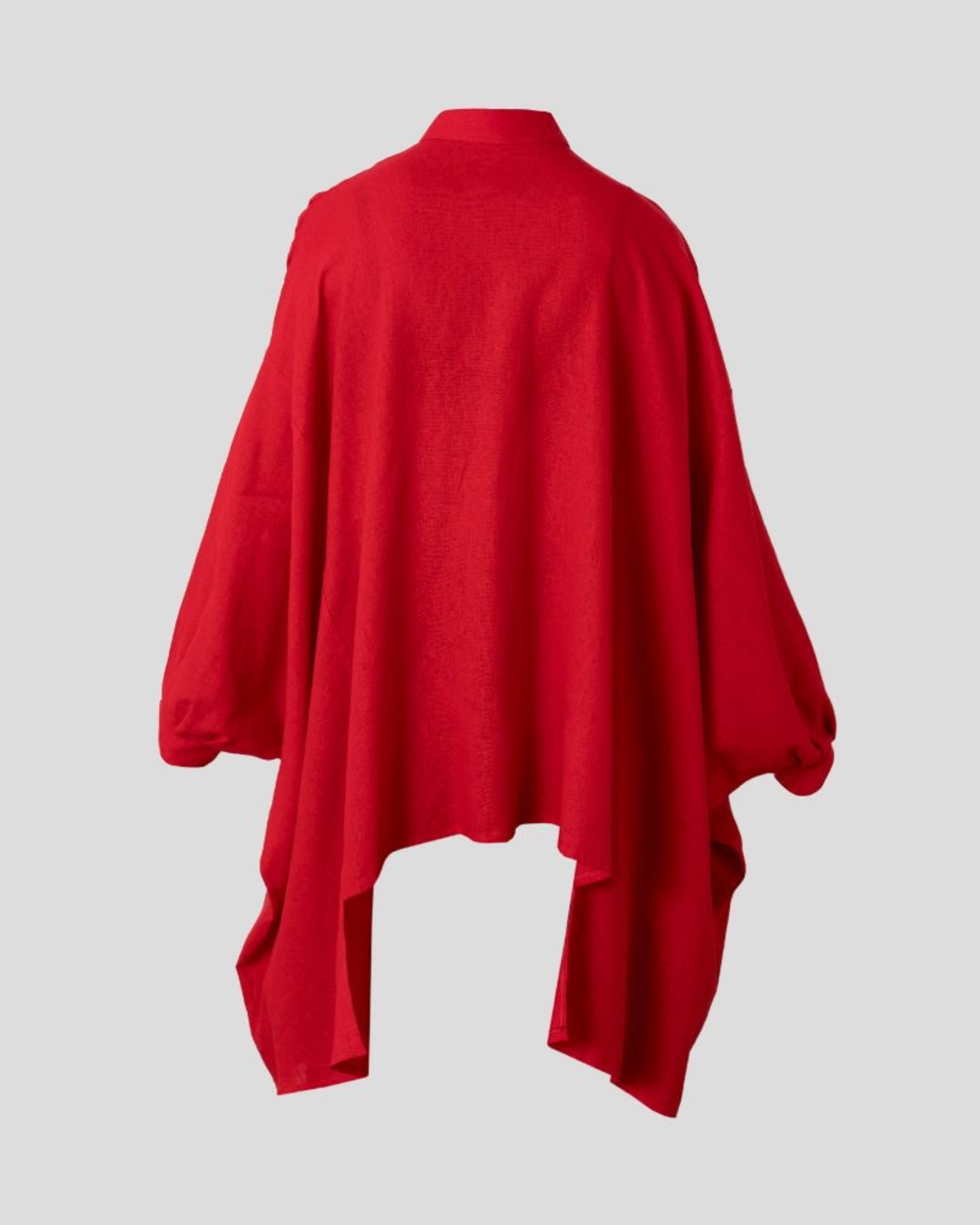 Red poncho on a light gray background
