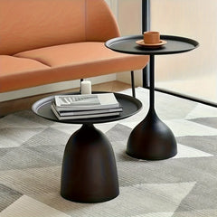 Two round nesting side tables in black metal with tray tops