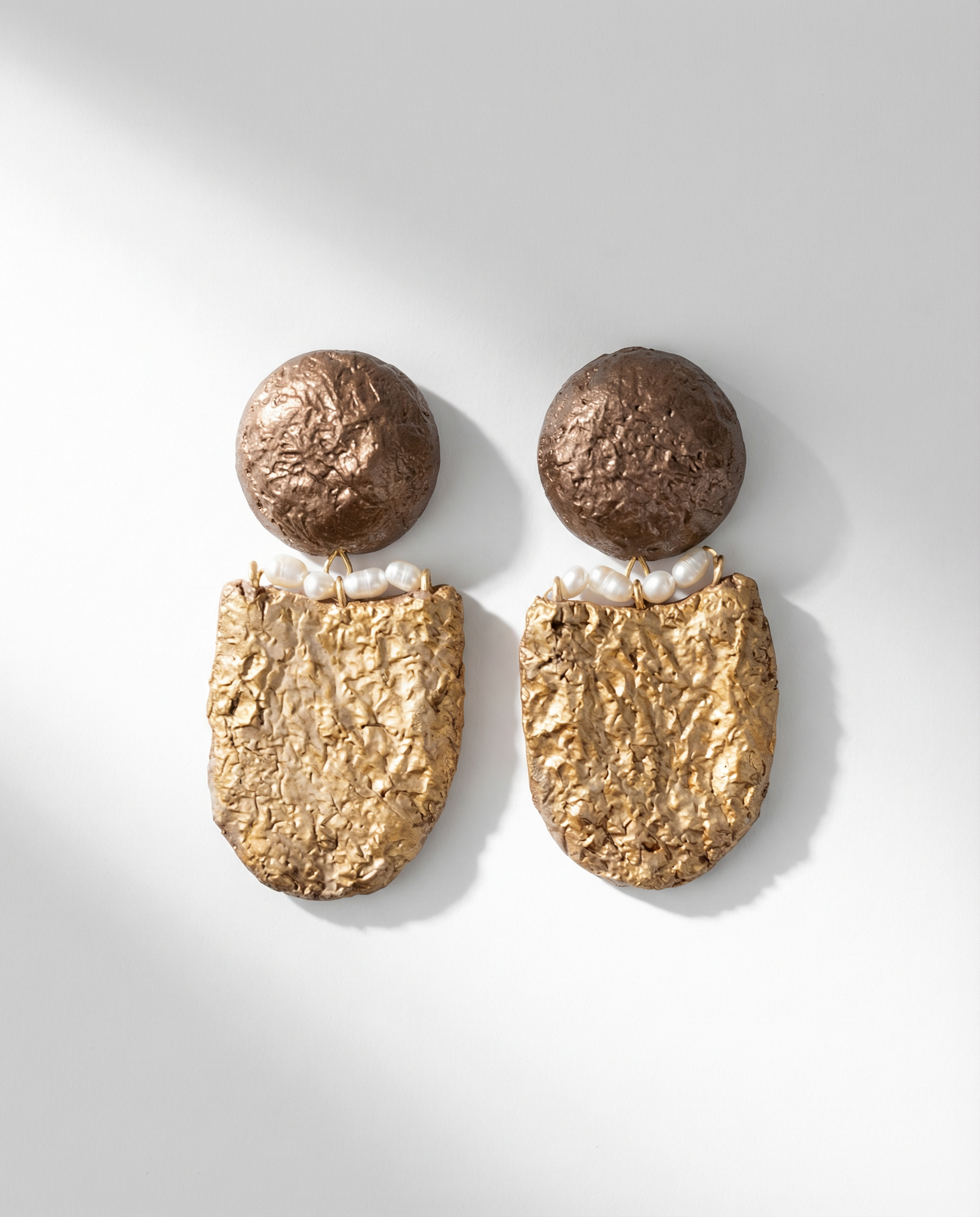 handmade gold sculptural earrings with pearls