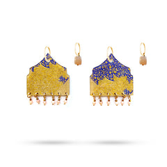 Pair of gold and blue earrings on a white background