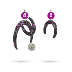 Pair of earrings with floral design and coin charm on a white background