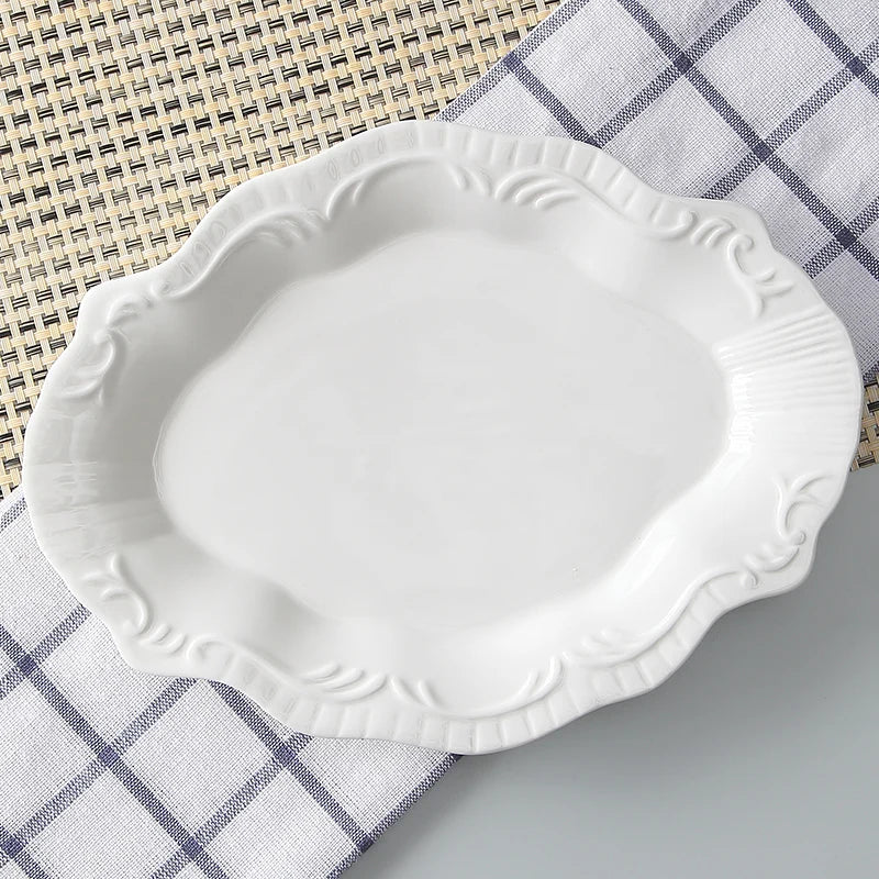 White decorative plate on a checkered cloth