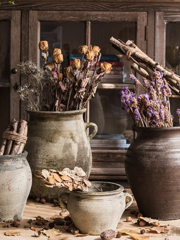 Earthy-toned tabletop ceramic vases in wabi-sabi style