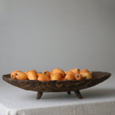 Handcrafted retro wooden fruit tray on linen tablecloth
