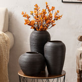 Minimalist Japanese-style ceramic vases on wood table