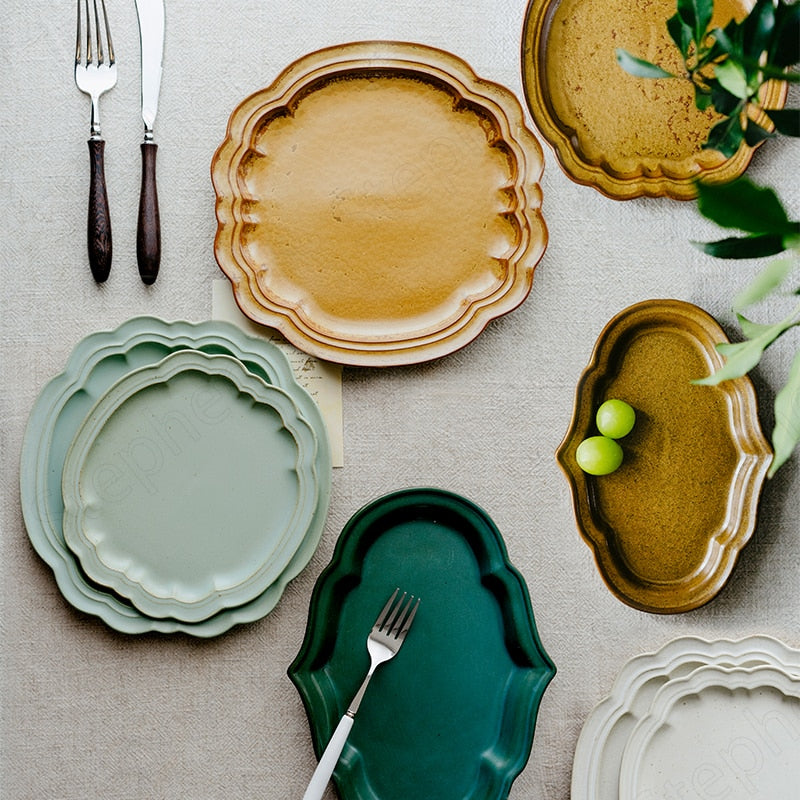 Irregular green and brown ceramic plates on a dining table