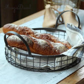 Antique black wire basket used as a bread server