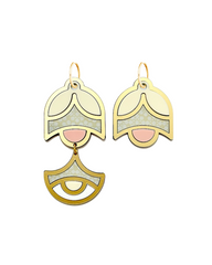Close-up of handmade asymmetrical earrings in blush and gold tones on white background