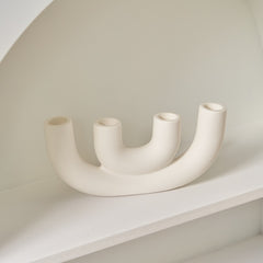Contemporary ceramic candelabra with curved design