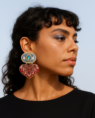 Model wearing handmade lightweight statement earrings in blue denim and red brocade