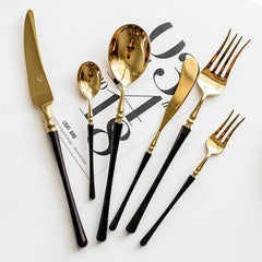 4-piece golden stainless steel flatware set with black handles