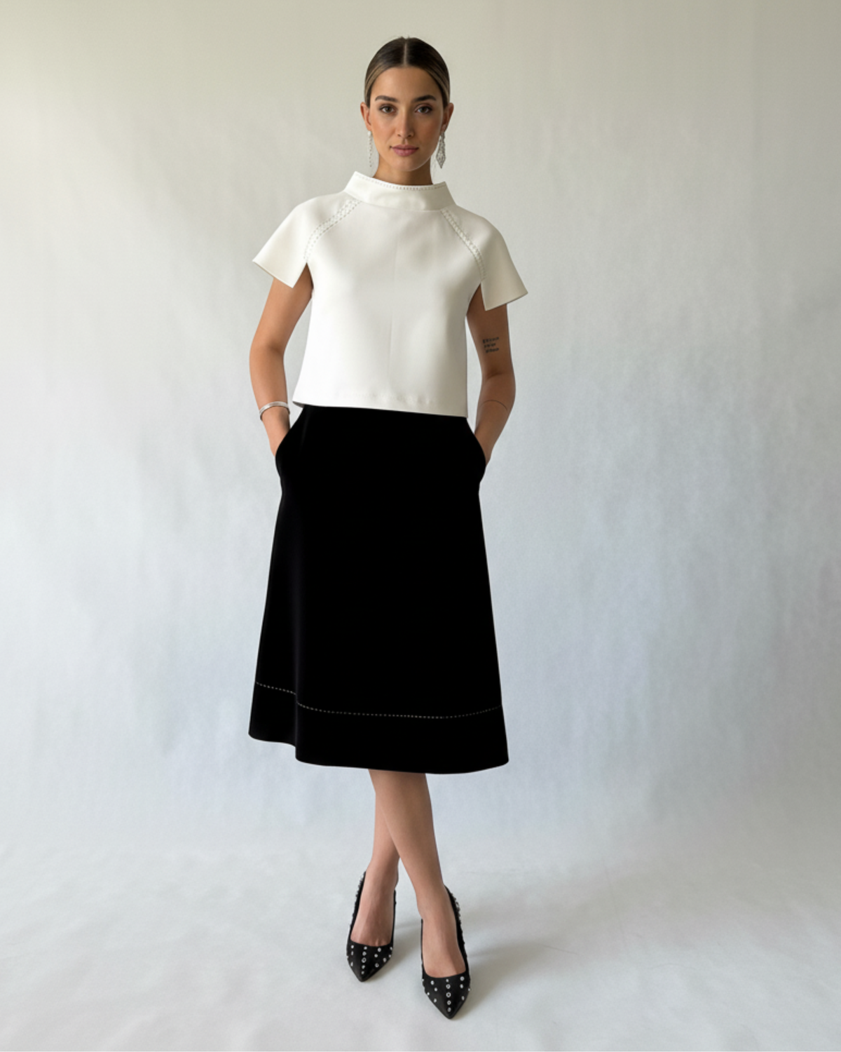 Woman wearing a statement white top 