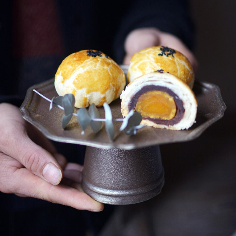 Metal dessert stand with pastries
