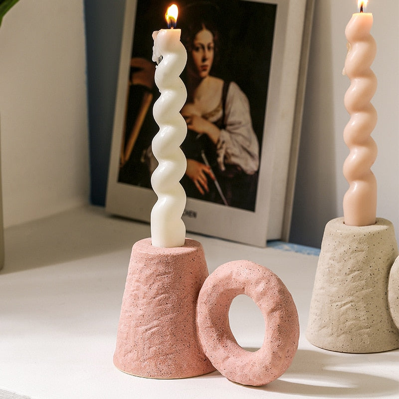 Modern sculptural candle holder in ceramic material