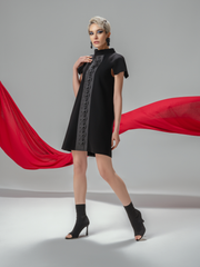 Model wearing black origami dress with handmade silk details