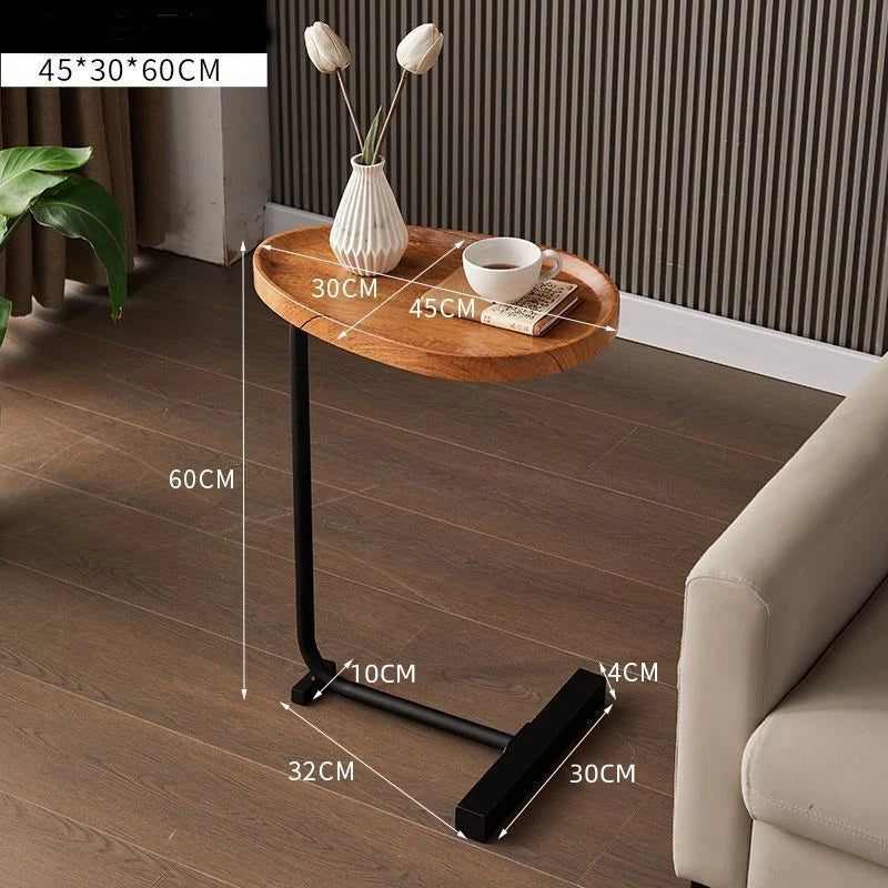 Small wooden side table with dimensions labeled in a living room setting.