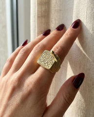 Square face brass statement ring on hand