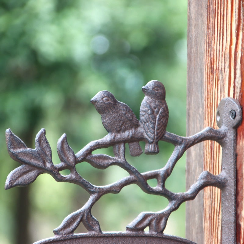 metal door welcome sign mounted on wooden post