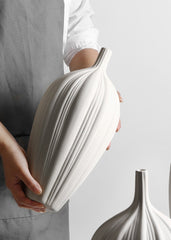 sculptural porcelain flower vase on table