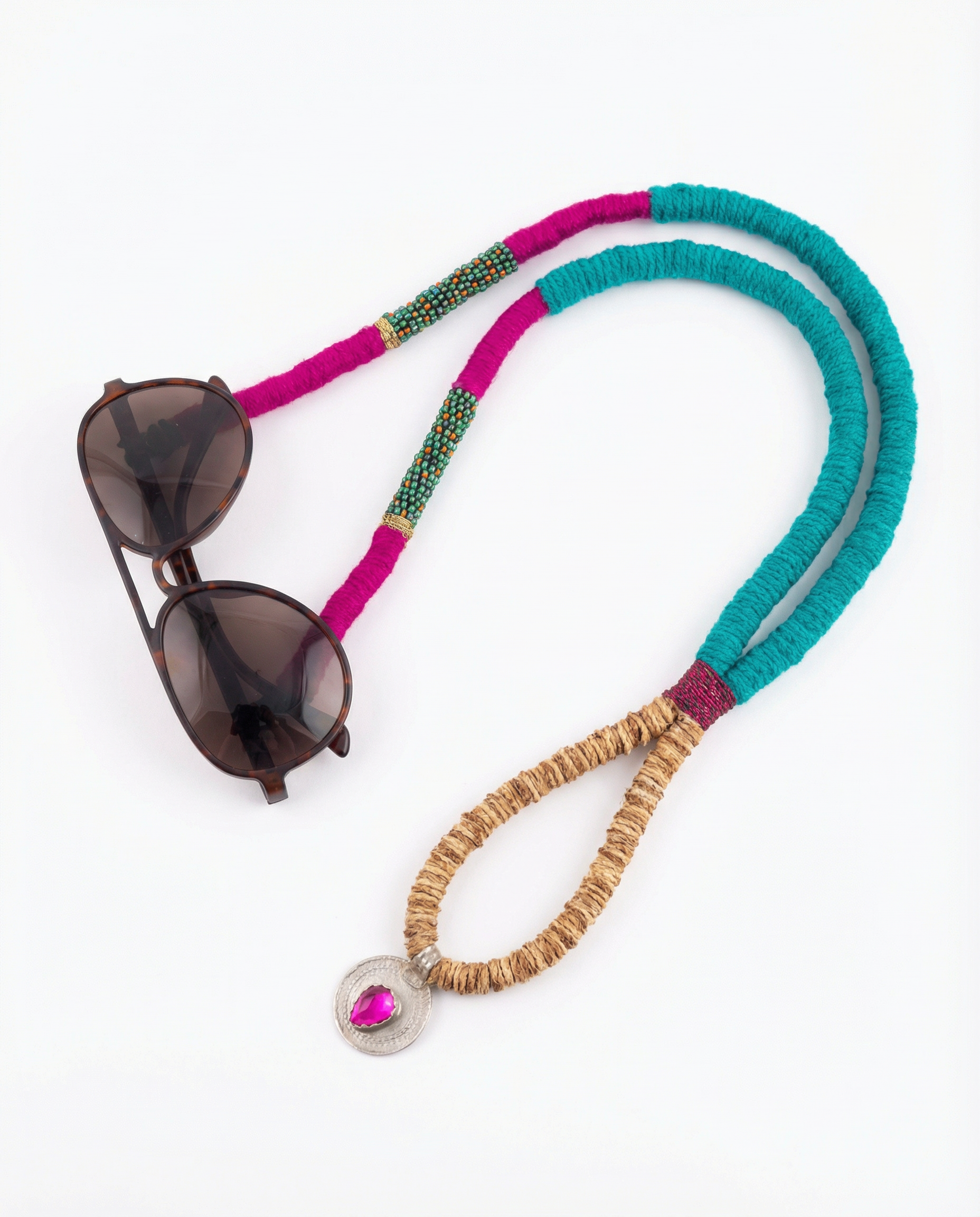 Sunglasses with a colorful beaded strap on a white background